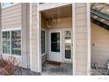 Close-up of the front door of unit 102 with sidelight windows at 1016 Opal St # 102, Broomfield, CO 80020