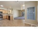 Open floor plan that connects the kitchen to the living room at 1016 Opal St # 102, Broomfield, CO 80020