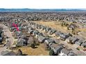 Expansive aerial view showcasing the neighborhood and surrounding green spaces at 1536 Goshawk Dr, Longmont, CO 80504