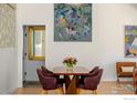 Elegant dining area featuring stylish chairs, a wood table and eye-catching artwork at 1707 Grape Ave, Boulder, CO 80304