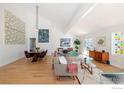 Open concept living space featuring vaulted ceilings, wood floors and access to the outdoors at 1707 Grape Ave, Boulder, CO 80304
