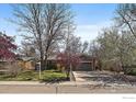 Beautiful single-Gathering home with lush green lawn and an attached two-car garage at 1746 Shavano St, Longmont, CO 80504