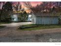 Charming home exterior with an extra detached garage and spacious driveway at 1780 Redwood Ave, Boulder, CO 80304