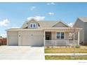 Charming home featuring a three-car garage, a covered porch, and well-maintained landscaping at 226 Ole Bessie Dr, Berthoud, CO 80513