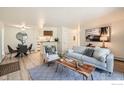 Open floor plan with living and dining areas featuring updated decor and a breakfast bar at 2800 Kalmia Ave # C212, Boulder, CO 80301