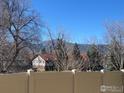 Scenic view of mountains and neighborhood from a fenced property offering privacy and natural beauty at 3300 Bridger Trl # 110, Boulder, CO 80301