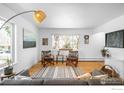 Bright living room with hardwood floors, modern decor, and large windows offering plenty of natural light at 345 Colgate St, Boulder, CO 80305