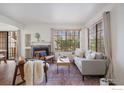 Inviting living room features a fireplace, plush seating, and bright windows at 4819 White Rock Cir # C, Boulder, CO 80301