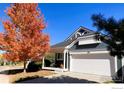 Well-maintained home featuring a landscaped yard and a convenient two-car garage at 506 Entrada Dr, Golden, CO 80401