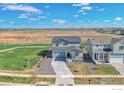 Aerial shot showcasing the home's placement in the neighborhood, surrounded by open land at 5805 Red Barn Ave, Mead, CO 80542