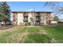 Charming exterior view of the building showcasing the architecture and surrounding landscaping at 12113 Melody Dr # 104, Denver, CO 80234