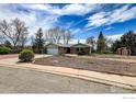 Charming single Gathering home with mature trees and a detached garage, ideal for suburban living at 12891 Columbine Dr, Longmont, CO 80504