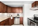 Updated kitchen featuring stainless steel appliances, tiled backsplash, and granite countertops at 2351 Federal Blvd # 102, Denver, CO 80236