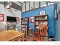 Office area with blue accent wall, natural lighting and wood trim accents at 2400 N Broadway # 5, Denver, CO 80205