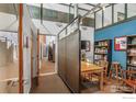 Office area with view to hallway, wood trim accents, blue accent wall at 2400 N Broadway # 5, Denver, CO 80205