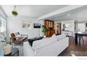 Bright living room with modern decor, hardwood floors, and stylish furniture at 285 Holbrook St, Erie, CO 80516