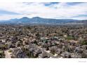 Scenic aerial view of the home in its neighborhood with the mountains as a dramatic backdrop at 4027 Guadeloupe St, Boulder, CO 80301