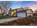 Charming two-story home with attached garage and mature landscaping at 4547 Ashfield Dr, Boulder, CO 80301