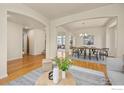 Spacious dining room with hardwood floors and modern chandelier fixture at 4575 Maple Ct, Boulder, CO 80301