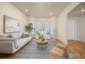 Bright living room featuring hardwood floors, bay windows and neutral decor at 4575 Maple Ct, Boulder, CO 80301