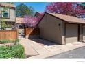 Two-story home featuring an attached two-car garage, and a well maintained lawn with mature landscaping at 4654 Greenbriar Ct, Boulder, CO 80305