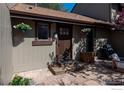 Exterior shot featuring a patio, entry door and flower boxes with a neutral color palette at 4654 Greenbriar Ct, Boulder, CO 80305