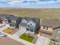 Suburban homes with open land and views of the mountains from a far distance at 5453 Bauer Dr, Frederick, CO 80504