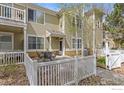 Charming townhome exterior featuring a private patio with seating and a well-maintained garden at 640 Gooseberry Dr # 1103, Longmont, CO 80503