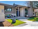Modern home features well-manicured landscaping and a welcoming front porch with outdoor seating at 6923 Hunter Pl, Boulder, CO 80301