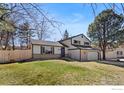Charming two-story home with a well-manicured lawn and an attached garage at 7203 S Cody Way, Littleton, CO 80128