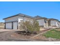 Spacious three-car garage attached to a well maintained single story home at 10071 E 142Nd Ave, Brighton, CO 80602