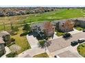 Stunning aerial view of a home near a golf course, showcasing well-maintained landscaping and neighborhood at 13122 Grant N Cir # B, Thornton, CO 80241