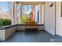 Inviting front porch featuring classic columns and a bench for relaxing at 1373 N Franklin St # 1, Denver, CO 80218