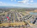 An aerial view highlighting the property's proximity to a park, lake, and surrounding community amenities at 1433 Moonlight Dr, Longmont, CO 80504