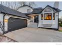Charming home featuring a two-car garage, modern stairs, and a cozy bench to enjoy the outdoors at 1540 Sumac Ave, Boulder, CO 80304