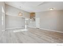 Bright living room with high ceilings and staircase at 16457 Lafayette St, Thornton, CO 80602