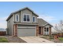 Charming two-story home featuring a well-maintained yard and an attached two-car garage at 16645 W 2Nd Ave, Golden, CO 80401