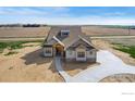 Beautiful exterior featuring a walkway and stone accents on a new construction home at 1920 Country Dr, Frederick, CO 80504