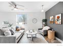 Cozy living room with neutral tones, comfortable seating, and natural light at 2018 Ionosphere St # 8, Longmont, CO 80504