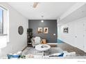 Comfortable living room with stylish decor and a gray accent wall at 2018 Ionosphere St # 8, Longmont, CO 80504