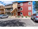 Condo exterior shows parking spaces and multiple balconies for outdoor relaxation and enjoyment at 2879 Shadow Creek Dr # 306, Boulder, CO 80303