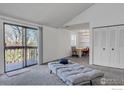 Inviting living area leads to dining space and features balcony access for a blend of indoor-outdoor living at 2879 Shadow Creek Dr # 306, Boulder, CO 80303