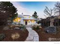 Charming single-story home with a beautiful stone walkway and landscaped front yard, plus an inviting patio at 2942 4Th St, Boulder, CO 80304