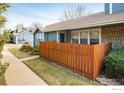 A well maintained front exterior showcasing the home's facade and yard at 3823 Paseo Del Prado, Boulder, CO 80301