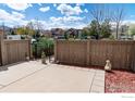 Private patio with fence, gate, landscaping and space for outdoor entertaining at 4150 Longview Ln, Boulder, CO 80301