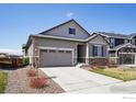A well-maintained single-Gathering home with a two-car garage and a neatly paved driveway at 450 Pikes View Dr, Erie, CO 80516