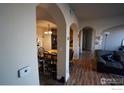 Spacious living room with hardwood floors and arched openings to other rooms at 4500 Baseline Rd # 4104, Boulder, CO 80303
