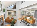 Open-concept living space with a view of the kitchen, modern furniture, and plenty of natural light at 4725 Spine Rd # E, Boulder, CO 80301