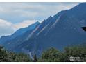 Scenic view of the Flatirons mountains in Boulder Colorado, providing a serene backdrop at 516 Valley View Dr, Boulder, CO 80304