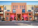 Striking building with a unique architectural design and colorful facade at 801 Confidence Dr # 2, Longmont, CO 80504